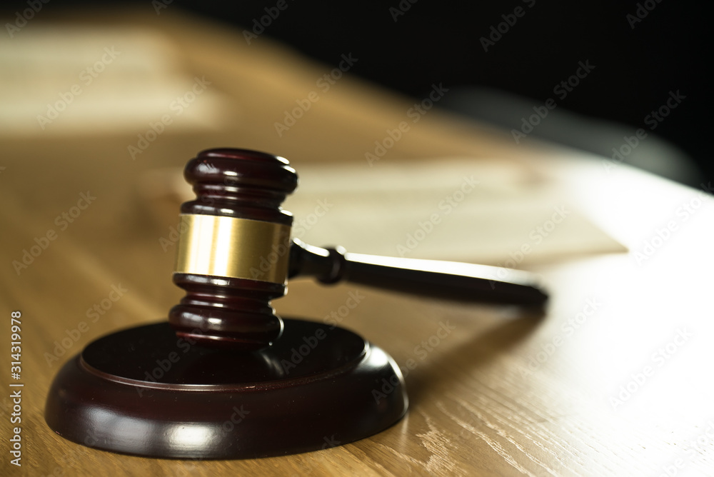 Symbol of law and justice on wooden table in lawyer office