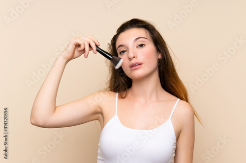 Young brunette girl over isolated background
