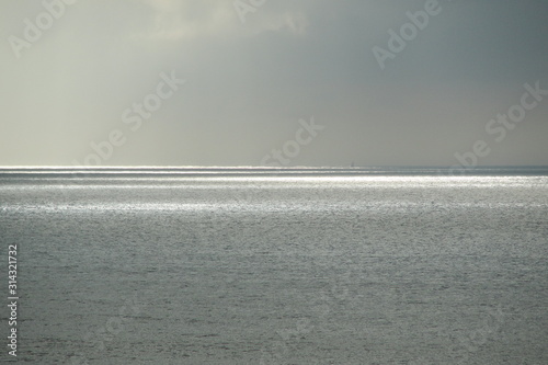 grey sky over the ocean calm
