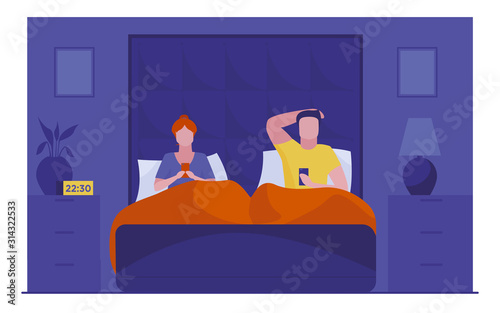 Couple resting in bed and using smartphones
