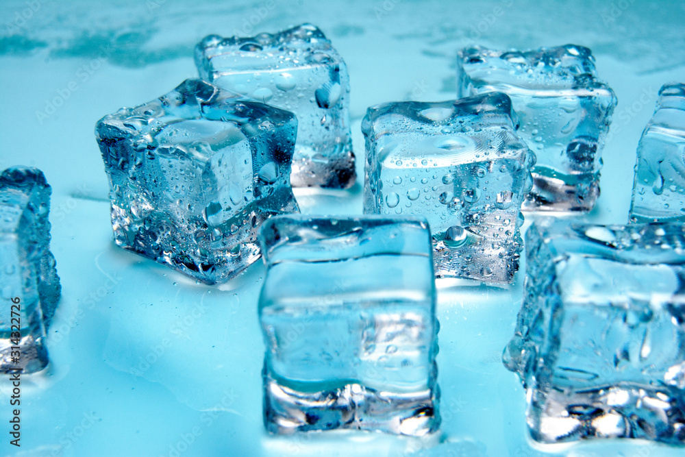 Ice cubes / Water drops on ices / Crystal clear ices cubes on blue background. Ice cubes / Water drops on ices / Crystal clear ices cubes on blue background.
