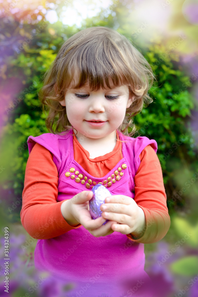 cute little girl looking for easter eggs cute little girl looking for easter eggs