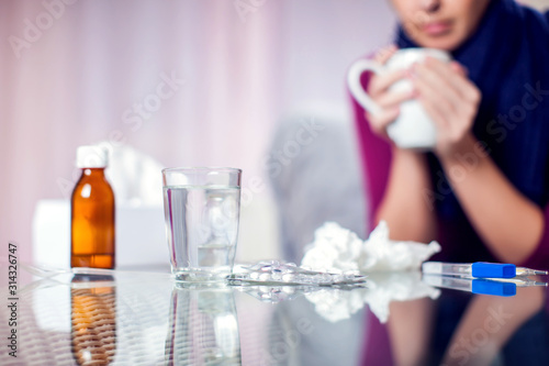 Woman got the flu and drinking hot tea. People, healthcare and medicine concept