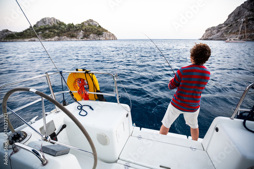 Man fishing in the sea from the boat