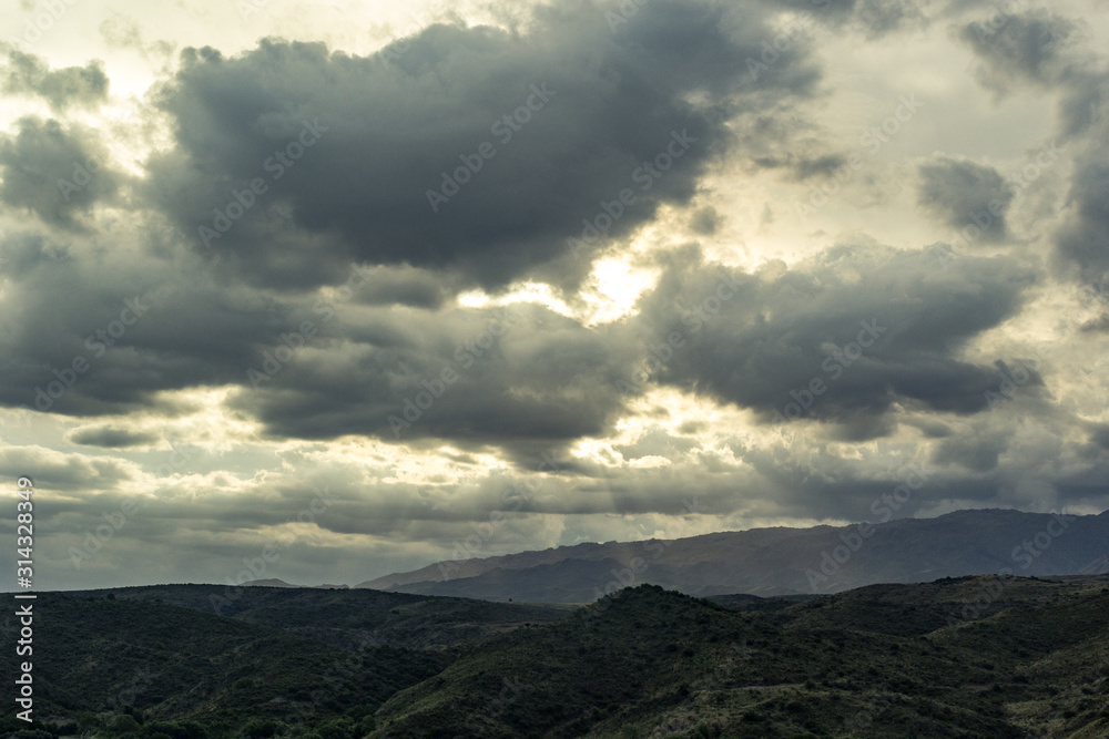 sunset cloudy sky in the hills golden hour