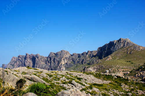 View of Mountains with Beautiful Blue Sky in Background at the Pointview in the city of Cala Sant Vicent, Mallorca, Spain, 2018