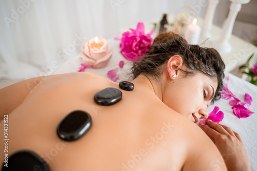 Young girl in spa massage on holiday 