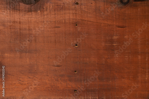 Brown wood background with scuffs and scratches. Wood texture.