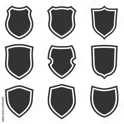 Shield shape icons set. Gray label signs. Symbol of protection