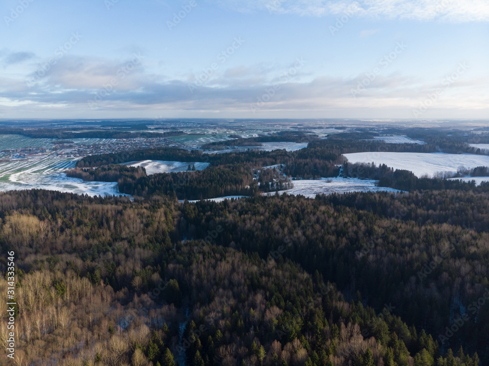 Winter nature, forest, river, village. View from above. Shooting from a copter.