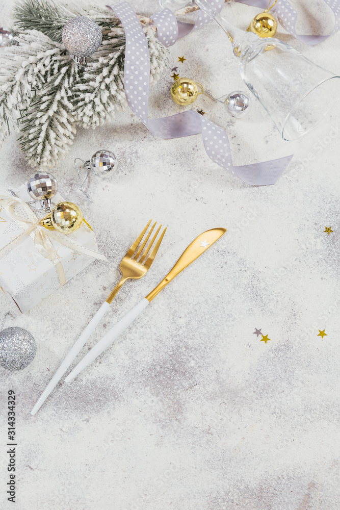 Christmas creative composition with cutlery, Christmas gift, fir branches, decoration Christmas creative composition with cutlery, Christmas gift, fir branches, decoration