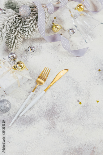 Christmas creative composition with cutlery, Christmas gift, fir branches, decoration © svittlana