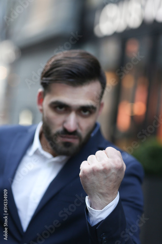 fist, fists, hand gesture, bad boy, man, face, evil, hate, people, style, young, mood, life, lifestyle, aggre, gestures, rage, fan, football, soccer, emotion, emotions, emotional, agressive photo