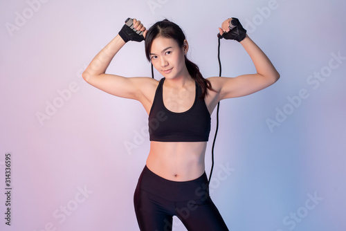 Fototapeta Naklejka Na Ścianę i Meble -  Beautiful asian fitnesses woman in studio