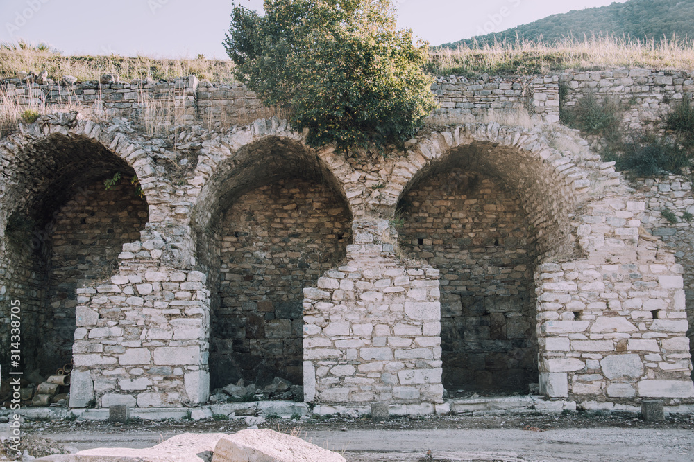 Antique city of Ephesus.Ruins of an ancient city in Turkey.Selcuk, Kusadasi, Turkey.Archaeological site,expedition.Remains of an abandoned ancient Greek city.Brick arches.Stone walls.Kuretov street.