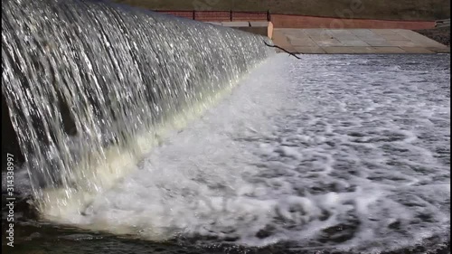 Dam on the river, weir waterfall fast water flow