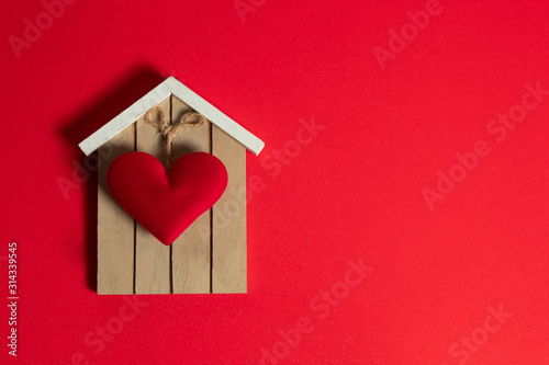 home and happiness family with love red heart decoration in festive holiday season greeting of valentine's day background