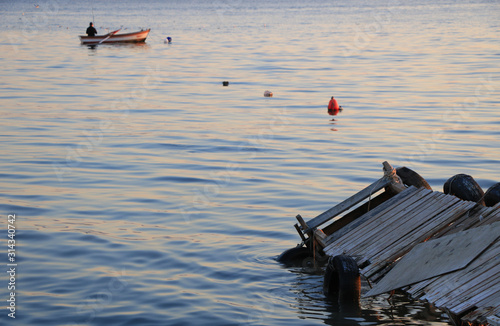 Canvas Print The fisherman is fishing while sundown in Marmara Sea, Turkey.