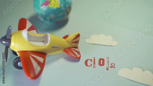 Airplane toy with CO2 word . Suitable for ecofriendly and sustainable journey concepts and the negative impact on the environment. photo