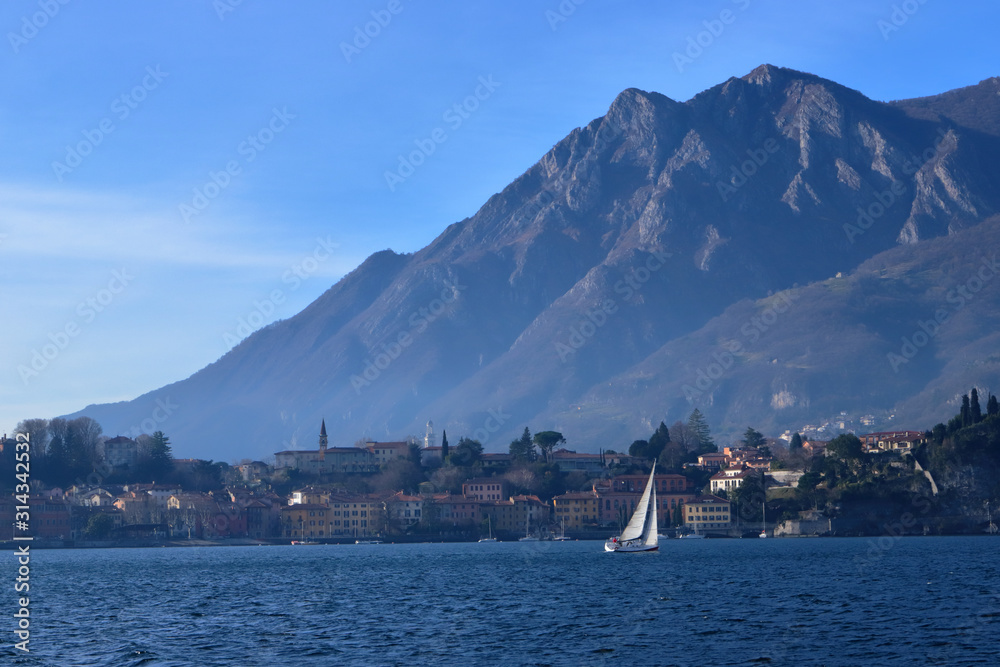 sailboat over the waters of como lake in italy 