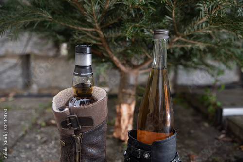 Christmas tree with a bottle of whisky in a shoe photo