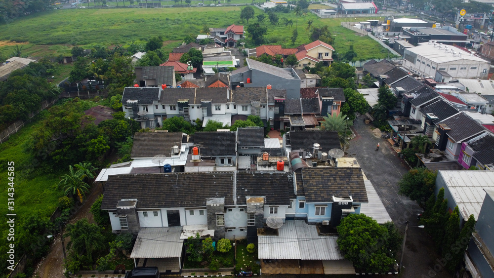 BEKASI, WESTJAVA, INDONESIA : JANUARY 10 2020 : Aerial shot view with a drone at house and highway