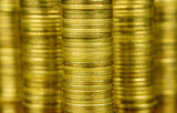 Shiny stacks of golden coins. Close up photo. Business concept. 