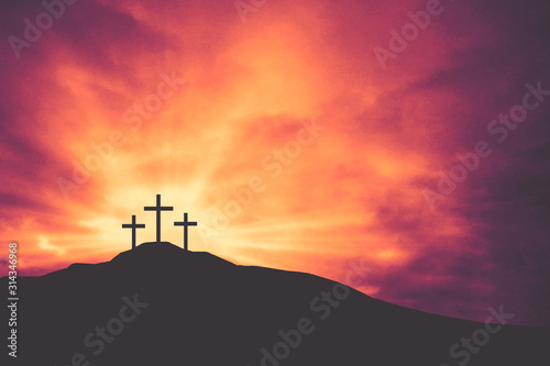 Papier peint Three Easter Crosses on Hill of Calvary with Bright Shining Light and Clouds Tex