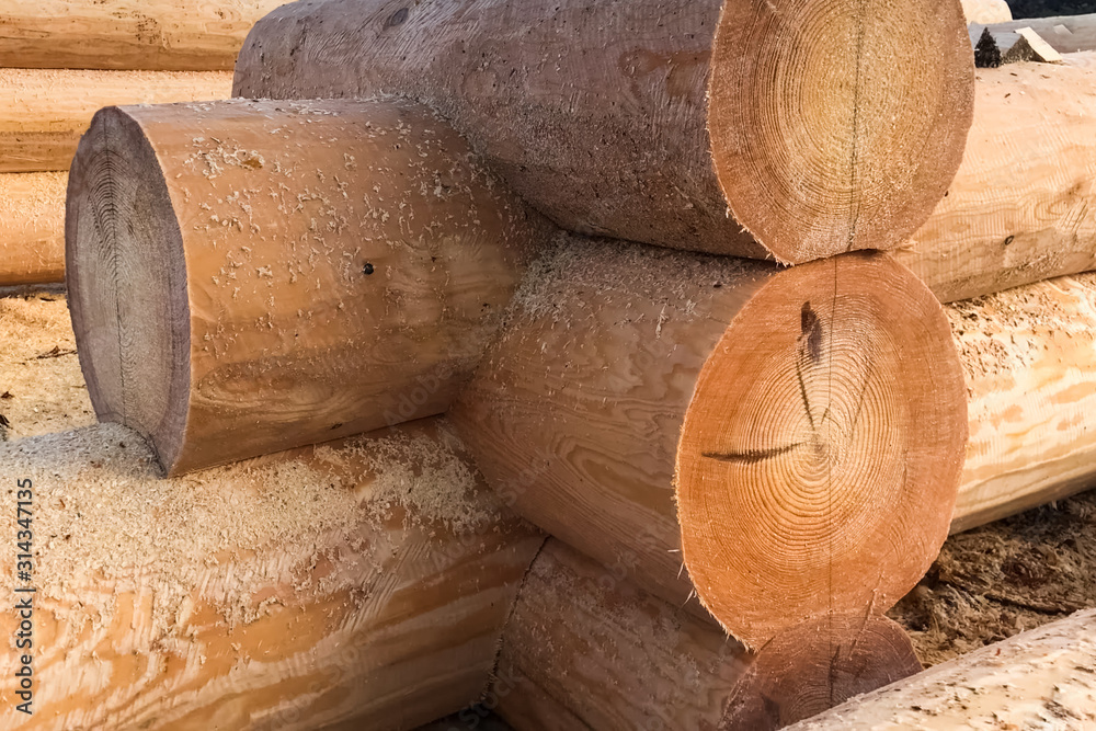 Drying and assembly of wooden log house at a construction base. Drying and assembly of wooden log house at a construction base.