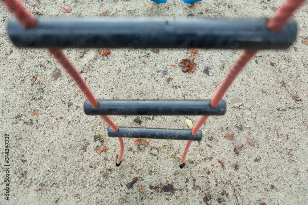 Closeup of rope climbing ladder an empty child playground