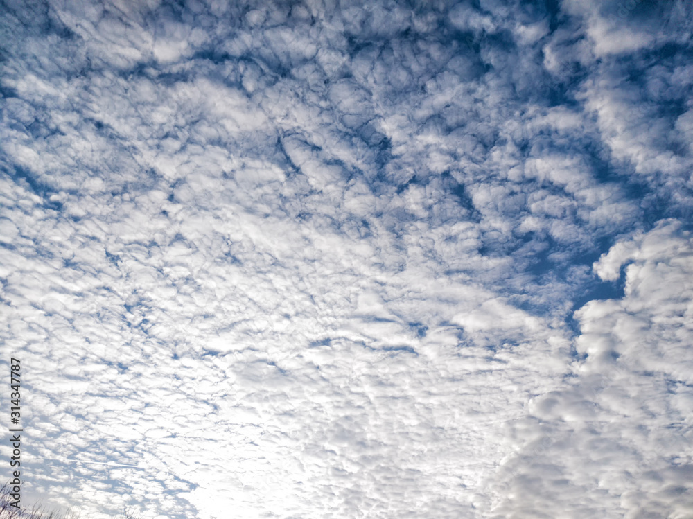 Many white clouds on blue sky background
