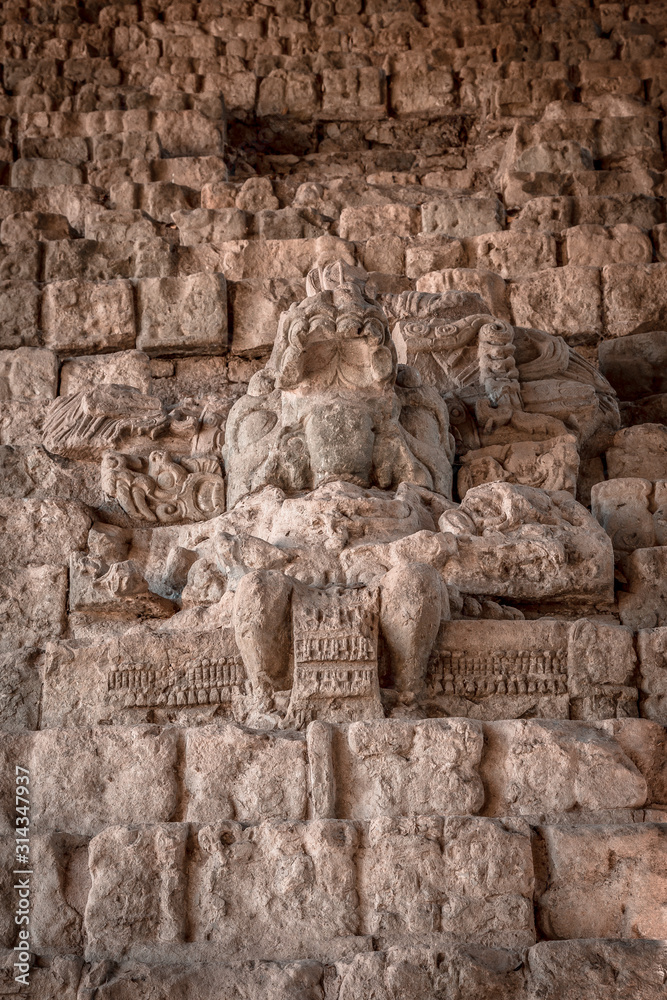 A Mayan figure on the stairs of the Copan Ruinas temples. Honduras
