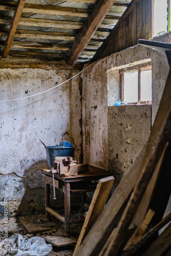 old abandoned house interior with broken furniture and empty windows © Martins Vanags