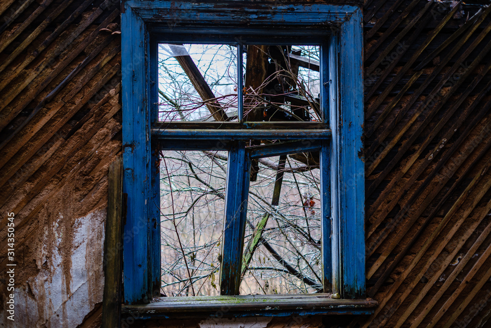 old abandoned house interior with broken furniture and empty windows