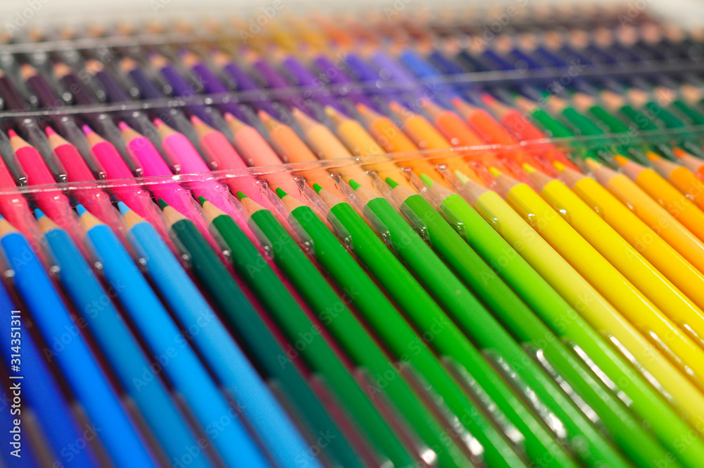 a lot of new colored pencils laid out in color. rainbow from pencils in a box. huge set for drawing. Tools for the artist a lot of new colored pencils laid out in color. rainbow from pencils in a box. huge set for drawing. Tools for the artist