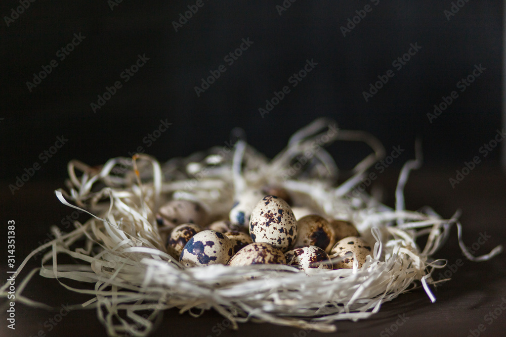 Eggs stacked in a pile or pyramid in a nest on a wooden background . for the Easter holiday . Easter background . new color and light for Easter photos and pictures Eggs stacked in a pile or pyramid in a nest on a wooden background . for the Easter holiday . Easter background . new color and light for Easter photos and pictures