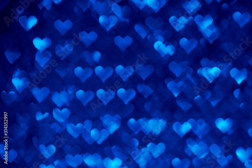 Abstract light, blue bokeh pattern in heart shape. St Valentides Day or Holiday concept, background image.