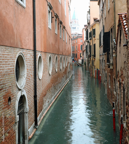 narrow navigable canal in Venice in Italy