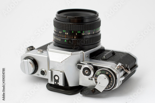 Classic analog single-lens reflex camera isolated on white background
