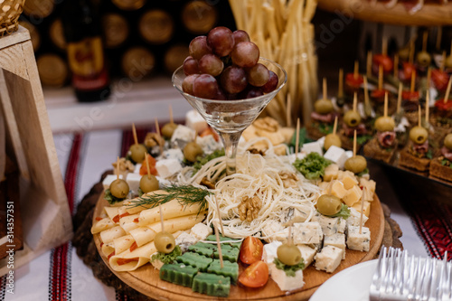 Cheese set and snacks on the banquet table buffet