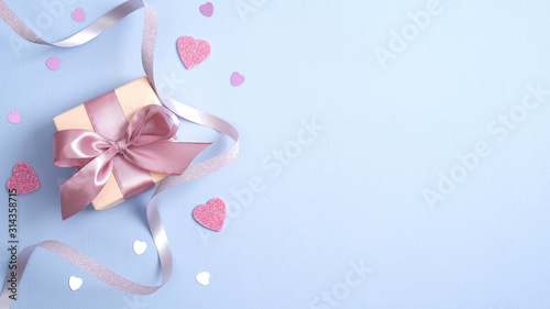 Valentines day background with gift box, ribbon, pink hearts. Valentines day surprise. Banner mockup for St Valentines day, Birthday or Mothers Day