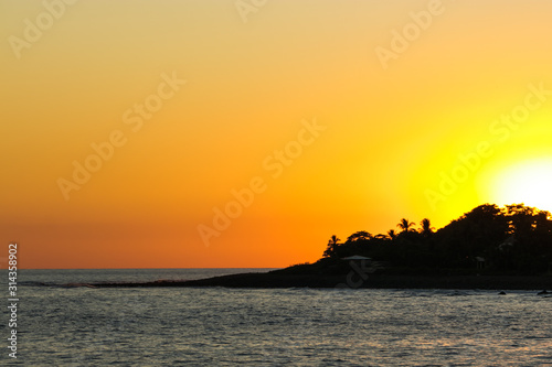 A beautiful Sunset at the beach with warm colors in the sky