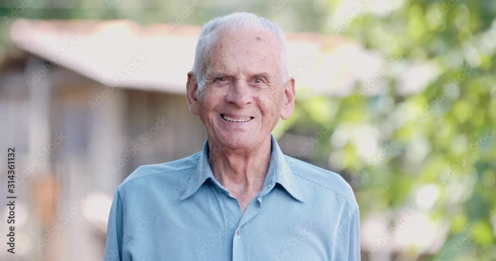 Smiling elderly man looking at camera. Cinematic 4K. Smiling elderly man looking at camera. Cinematic 4K.
