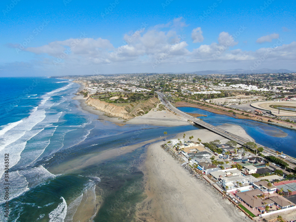 Aerial view of Del Mar North Beach, California coastal cliffs and House with blue Pacific ocean. San Diego County, California, USA