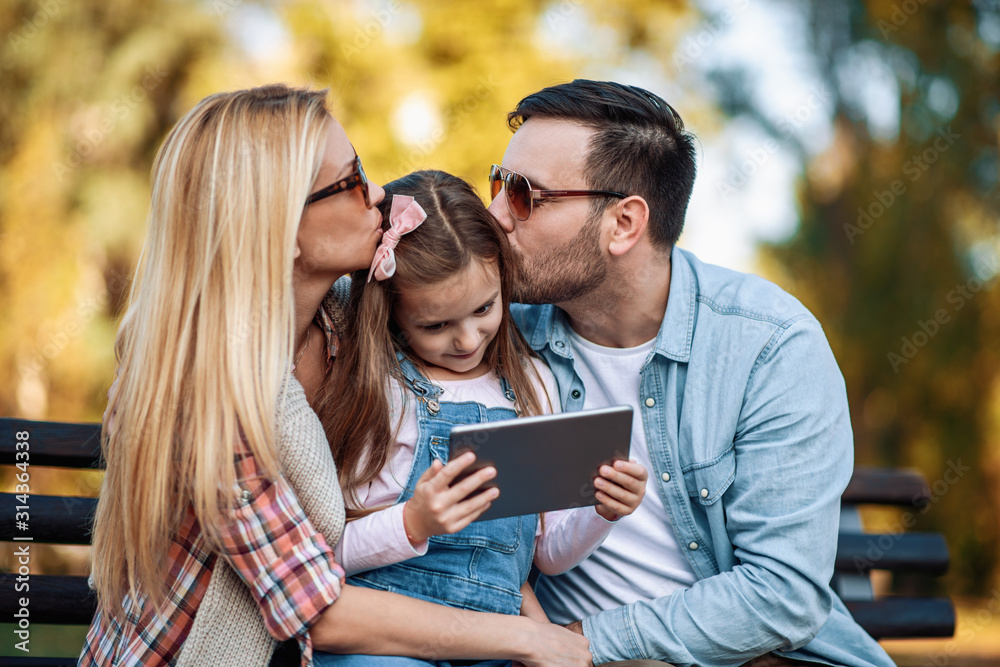 Happy family spending time together in the park Happy family spending time together in the park