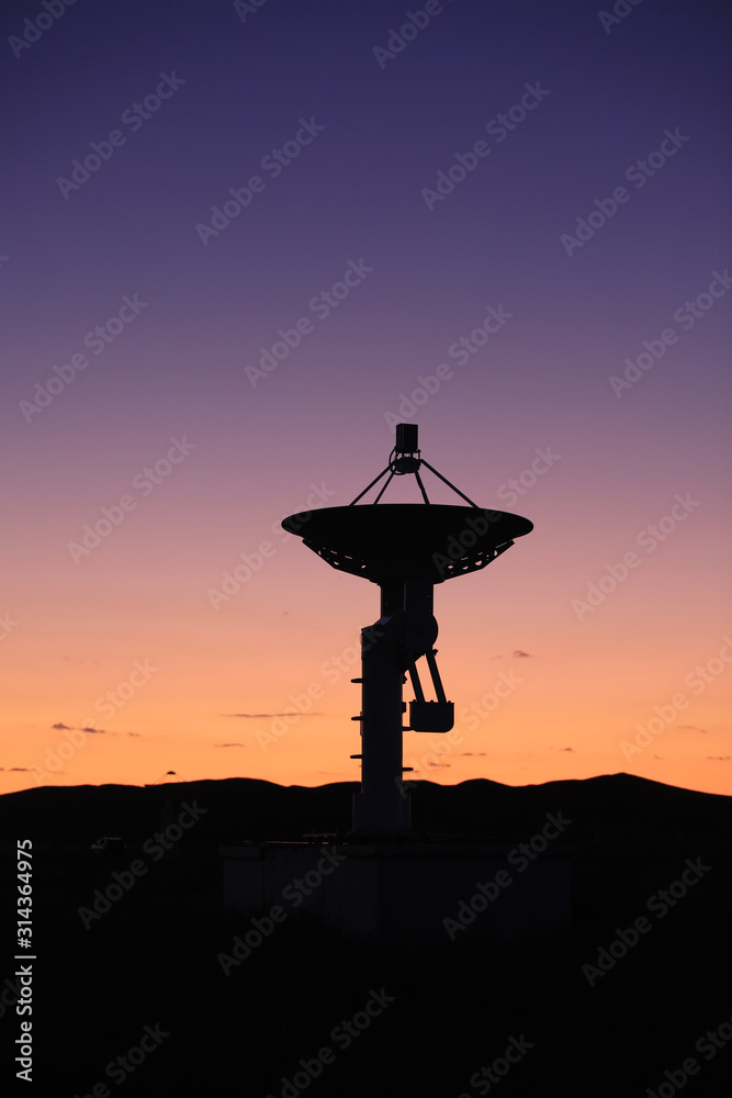 The silhouette of a radio telescope The silhouette of a radio telescope