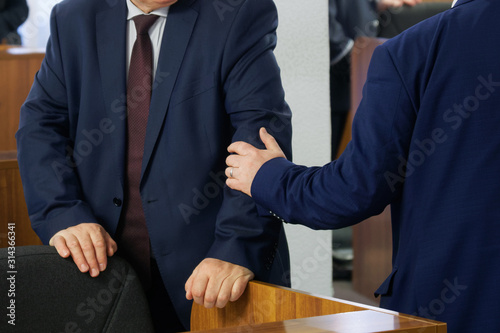 Obraz na plátně Politicians or businessmen greet each other before the start of a meeting or conference