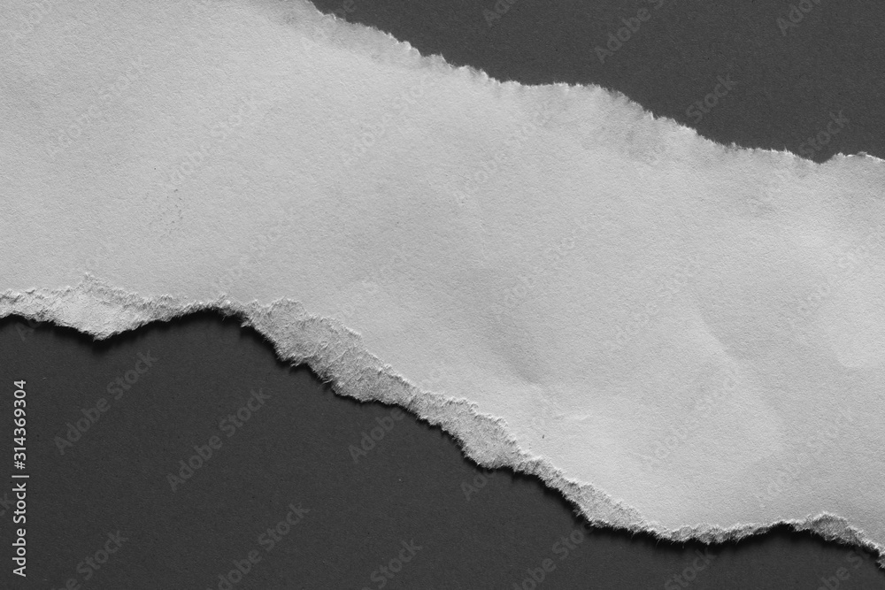 ripped paper isolated on black background with copy space for text ripped paper isolated on black background with copy space for text