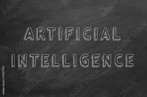 Hand drawing text Artificial intelligence on blackboard.