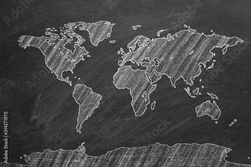 Fototapeta Naklejka Na Ścianę i Meble -  World map hand drawn chalk. Sketch on a blackboard.